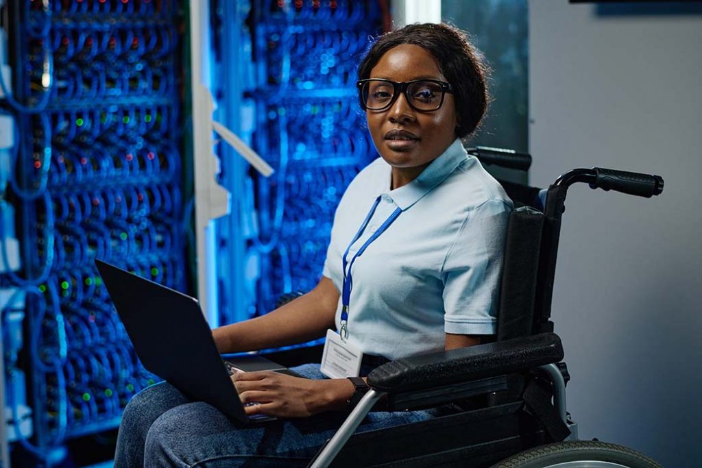Female with disability working on laptop